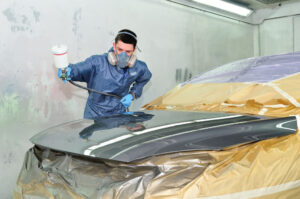 depositphotos_14046581-worker-painting-a-car